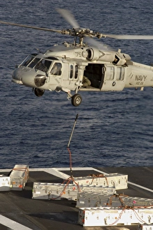 An MH-60S Seahawk delivers ammunition onto the flight deck of USS Theodore Roosevelt An MH-60S Seahawk delivers ammunition onto the flight deck of USS Theodore Roosevelt