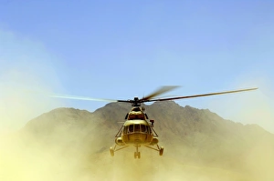 A Mi-17 Hip helicopter hovers over a firing range in Afghanistan A Mi-17 Hip helicopter hovers over a firing range in Afghanistan