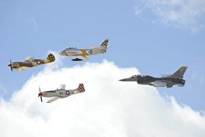 Military planes fly in formation during a Heritage Flight Military planes fly in formation during a Heritage Flight