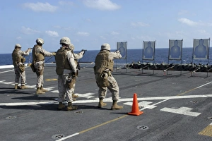 Military policemen train with the Berretta M9 9mm pistol aboard USS San Antonio Military policemen train with the Berretta M9 9mm pistol aboard USS San Antonio