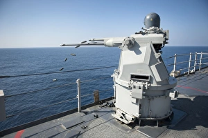 An Mk-38 machine gun system aboard USS Pearl Harbor An Mk-38 machine gun system aboard USS Pearl Harbor