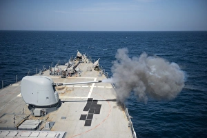 An MK-45 lightweight gun is fired aboard USS Arleigh Burke An MK-45 lightweight gun is fired aboard USS Arleigh Burke