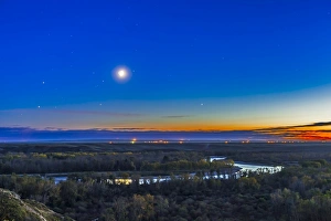 Moon with Antares, Mars and Saturn over Bow River in Alberta, Canada Moon with Antares, Mars and Saturn over Bow River in Alberta, Canada