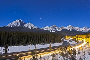 A moonlit nightscape over the Bow River and Morants Curve in Banff National Park, Canada A moonlit nightscape over the Bow River and Morants Curve in Banff National Park, Canada