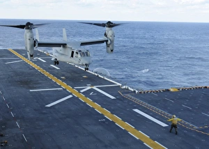 An MV-22 Osprey lands aboard the amphibious assault ship USS Iwo Jima An MV-22 Osprey lands aboard the amphibious assault ship USS Iwo Jima