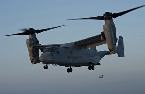 An MV-22 Osprey prepares to land on the flight deck of USS Anchorage An MV-22 Osprey prepares to land on the flight deck of USS Anchorage