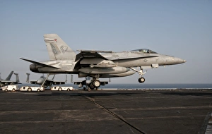 A US Navy F/A-18C Hornet prepares to land aboard USS Eisenhower A US Navy F/A-18C Hornet prepares to land aboard USS Eisenhower