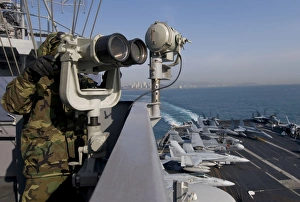 Operations Specialist Seaman stands as lookout watch on USS Carl Vinson Operations Specialist Seaman stands as lookout watch on USS Carl Vinson