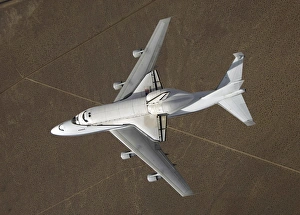 An overhead view of Space Shuttle Atlantis atop a modified 747 aircraft An overhead view of Space Shuttle Atlantis atop a modified 747 aircraft