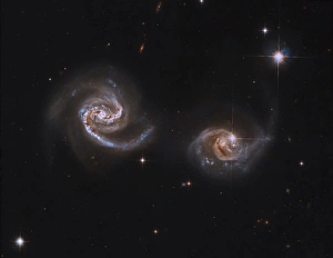A pair of interacting spiral galaxies with swirling arms A pair of interacting spiral galaxies with swirling arms