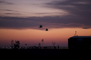 A pair of UH-60 Black Hawk helicopters approach their landing in Baghdad, Iraq A pair of UH-60 Black Hawk helicopters approach their landing in Baghdad, Iraq