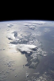 A panoramic view of the island of Hispaniola in the foreground and Cuba extending A panoramic view of the island of Hispaniola in the foreground and Cuba extending