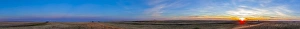 Panoramic view of the rising harvest moon and setting Sun, Alberta, Canada Panoramic view of the rising harvest moon and setting Sun, Alberta, Canada