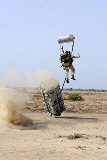 A pararescueman drops into the zone trailing his teams rescue supplies outside of Camp Lemonier A pararescueman drops into the zone trailing his teams rescue supplies outside of Camp Lemonier