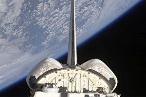 A partial view of Space Shuttle Endeavour backdropped by Earths horizon A partial view of Space Shuttle Endeavour backdropped by Earths horizon