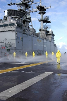 Personnel conduct Aqueous Film Forming Foam testing on the flight deck of USS Bataan Personnel conduct Aqueous Film Forming Foam testing on the flight deck of USS Bataan