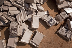 A pile of Meals Ready to Eat lies on the floor at a compound A pile of Meals Ready to Eat lies on the floor at a compound