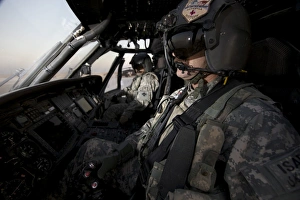 Pilot in the cockpit of a UH-60L Blackhawk helicopter Pilot in the cockpit of a UH-60L Blackhawk helicopter