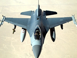 Pilot gives a thumbs up after successfully refueling his F-16 Fighting Falcon Pilot gives a thumbs up after successfully refueling his F-16 Fighting Falcon