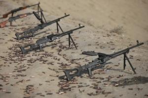 PK machine guns and spent cartridges at the firing range PK machine guns and spent cartridges at the firing range