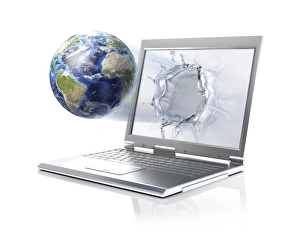 Planet Earth globe coming out from a laptop computer Planet Earth globe coming out from a laptop computer