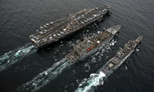 A replenishment at sea between USS Abraham Lincoln, USNS Guadalupe and USS Cape St A replenishment at sea between USS Abraham Lincoln, USNS Guadalupe and USS Cape St