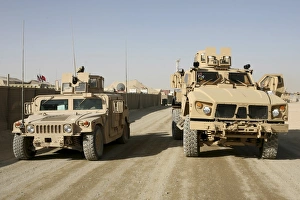 The Mine Resistant Ambush Protected All Terrain Vehicle and its predecessor, the humvee The Mine Resistant Ambush Protected All Terrain Vehicle and its predecessor, the humvee
