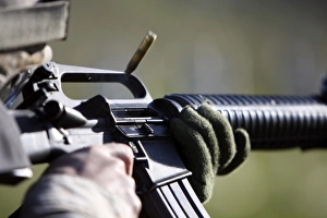 A round flies from the chamber of an M-16A2 service rifle A round flies from the chamber of an M-16A2 service rifle