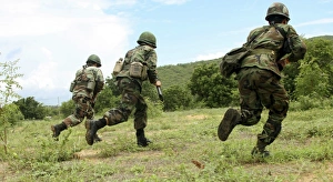 Royal Thai Marines rush forward to secure the site during an amphibious raid exercise Royal Thai Marines rush forward to secure the site during an amphibious raid exercise