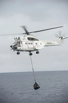 An SA-330 Puma transport helicopter moves cargo during a vertical replenishment An SA-330 Puma transport helicopter moves cargo during a vertical replenishment