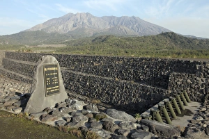 Sabo channel at Haramatsu River with tubular grid dam and Sakurajima volcano, Japan Sabo channel at Haramatsu River with tubular grid dam and Sakurajima volcano, Japan