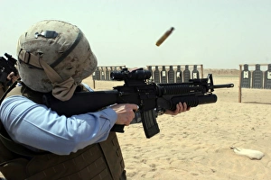 A Sailor fires a weapon A Sailor fires a weapon