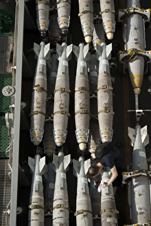 A Sailor maintains and cleans ordnance aboard USS Nimitz A Sailor maintains and cleans ordnance aboard USS Nimitz