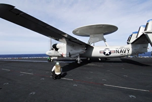 Sailors guide an E-2C Hawkeye to a steam driven catapult Sailors guide an E-2C Hawkeye to a steam driven catapult