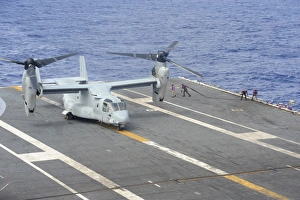 Sailors move into position to refuel a MV-22 Osprey Sailors move into position to refuel a MV-22 Osprey