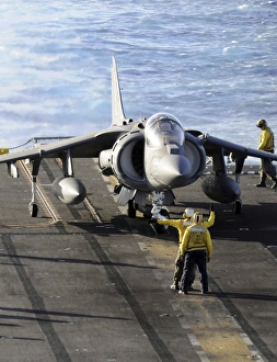 Sailors prepare to launch an AV-8B Harrier during flight operations aboard USS Peleliu Sailors prepare to launch an AV-8B Harrier during flight operations aboard USS Peleliu