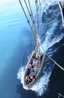 Sailors release lines from a rigid hull inflatable boat Sailors release lines from a rigid hull inflatable boat