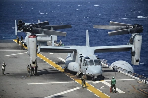 Sailors secure an MV-22 Osprey tiltrotor aircraft Sailors secure an MV-22 Osprey tiltrotor aircraft