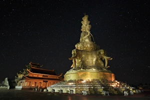 Samantabhadra statue on a dark starry night in Mount Emei, China Samantabhadra statue on a dark starry night in Mount Emei, China