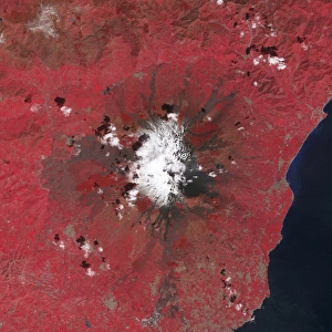 Satellite view of Mount Etna emitting plumes of volcanic gases Satellite view of Mount Etna emitting plumes of volcanic gases
