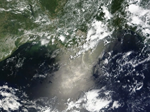Satellite view of streaks and ribbons of oil brighten the reflection of the Sun off Satellite view of streaks and ribbons of oil brighten the reflection of the Sun off