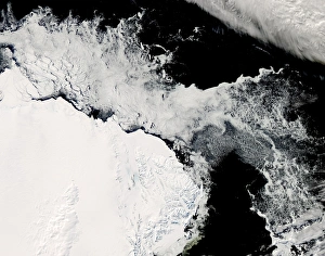 <b class=qtipBold><figcaption>Sea ice in the Southern Ocean</figcaption></b><br>February 24, 2008 - Late summer in the Southern Hemisphere. A satellite view of lingering sea ice in the Southern Ocean about 1, 000 kilometers north of McMurdo Station, the United Statesa Antarctic research hub. Large floes of ice are still visible in the near-shore waters in the left hand side of the image, but much of the remaining ice is in much smaller pieces. At the edge of the ice margin, the pieces of ice are small enough that at this spatial resolution (level of detail) they look like froth. The continent of Antarctica is visible in the bottom left of the image.<br><em>© Stocktrek Images</em> Sea ice in the Southern Ocean