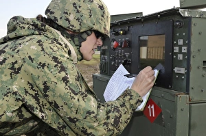 Seabee completes a generator check during a Command Post Exercise Seabee completes a generator check during a Command Post Exercise