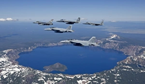 A five ship aircraft formation flies over Crater Lake, Oregon A five ship aircraft formation flies over Crater Lake, Oregon