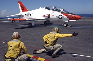 A shooter signlas the launch of a T-45A Goshawk trainer aircraft A shooter signlas the launch of a T-45A Goshawk trainer aircraft