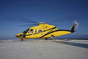 A Sikorsky S-76 utility helicopter prepares to take off from an oil rig A Sikorsky S-76 utility helicopter prepares to take off from an oil rig
