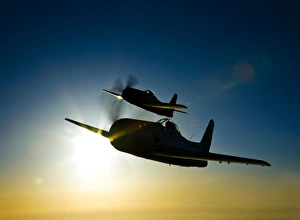 Silhouette of two Grumman F8F Bearcats in flight Silhouette of two Grumman F8F Bearcats in flight