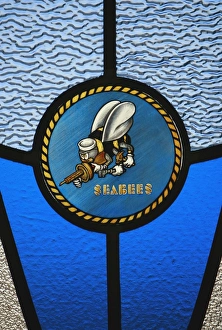A single Seabee logo built into a stained-glass window A single Seabee logo built into a stained-glass window