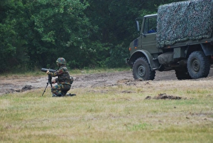 A soldier of the Belgian artillery unit sets up a device toA guide howitzer units A soldier of the Belgian artillery unit sets up a device toA guide howitzer units