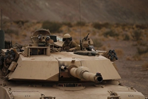 Soldier looks out the main hatch of his tank during a patrol Soldier looks out the main hatch of his tank during a patrol